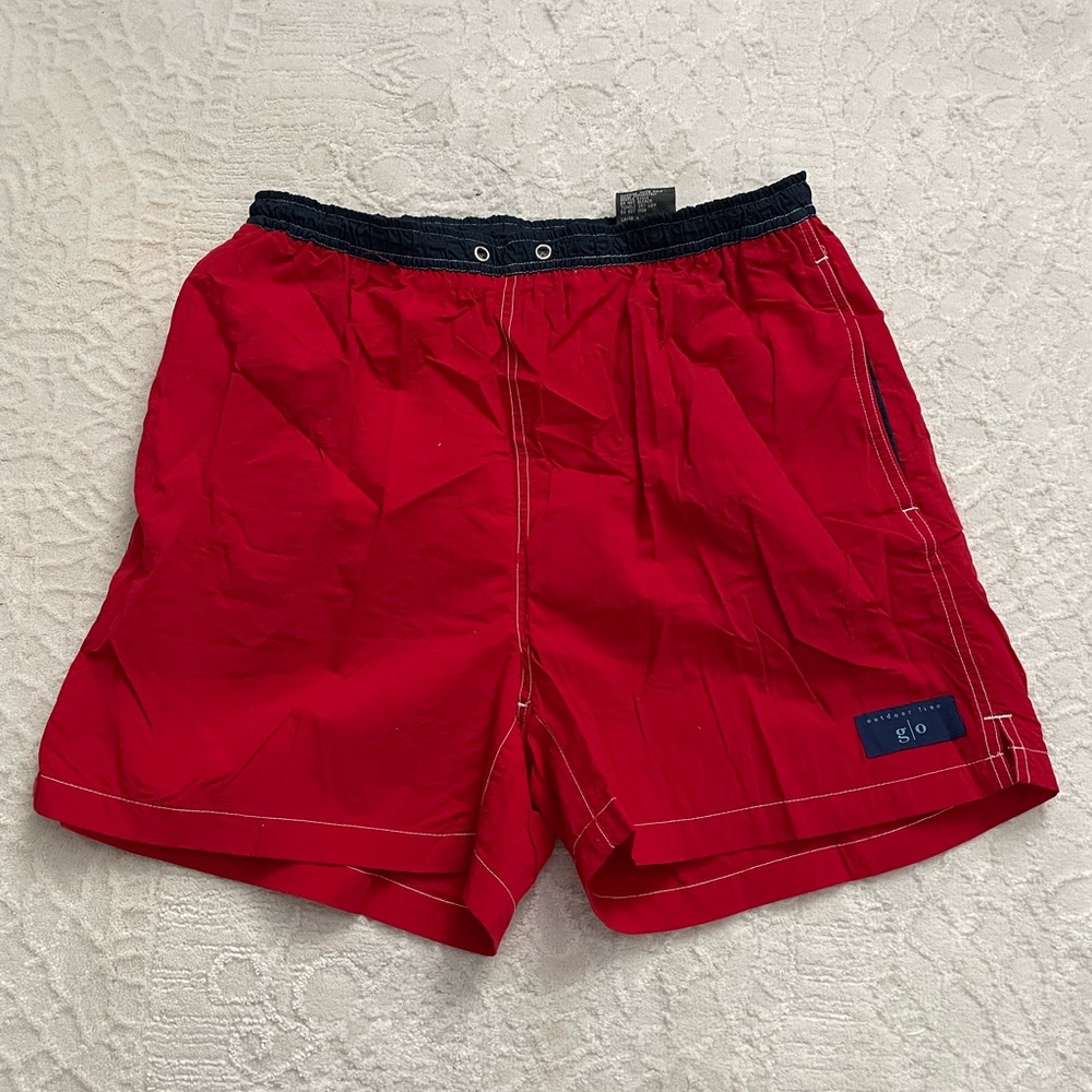 Red and navy swim trunks